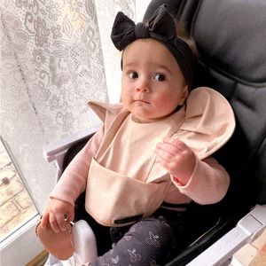 Eloise Details baby bib. Great at keeping outfits clean with messy meals.